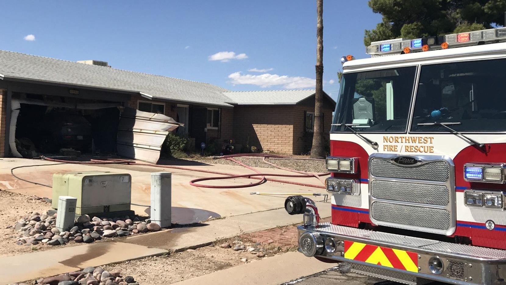 Torch used to burn weeds sparks garage fire on NW side